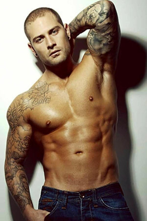 very good looking male stripper with tattoos and fantastic body wearing jeans