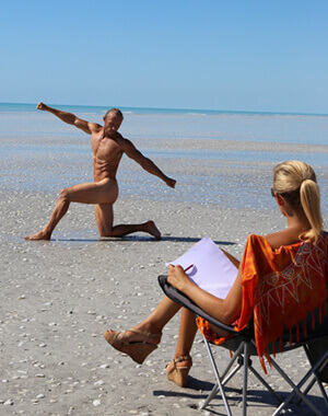 lifedrawing model posing for artist fully naked on a deserted australian beach