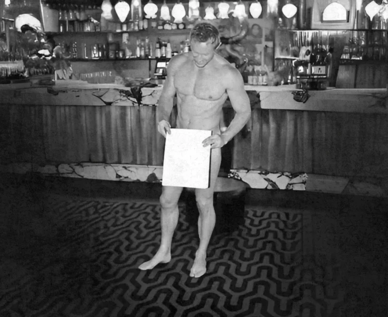 Shirtless model hosting life drawing party