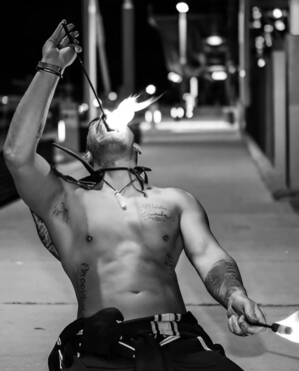 Male stripper performing outdoor show with Hens Knights