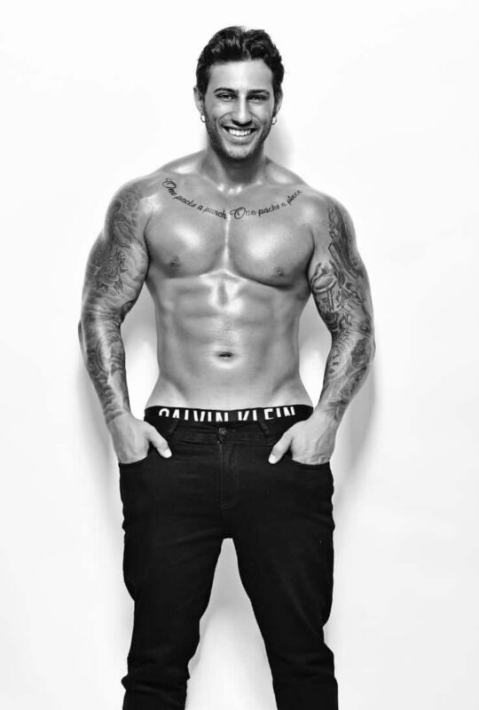 hot male stripper with tattoos and jeans