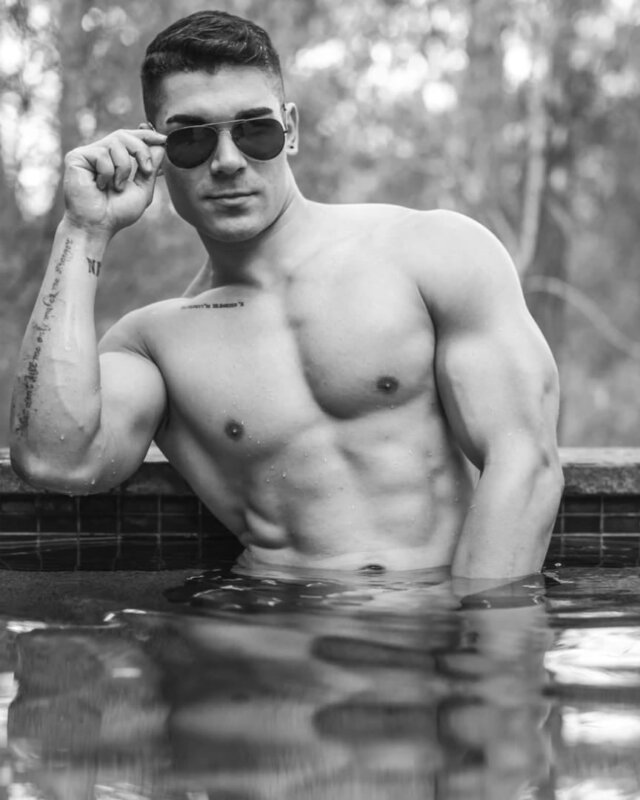 shirtless male Stripper in a hot tub